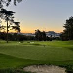 Panoramic view of a lush green golf course at Presidio Golf Course. Smooth