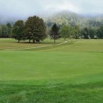 Panoramic view of a lush green golf course at Preston Country Club. Smooth