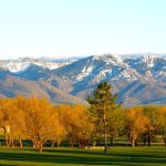 Panoramic view of a lush green golf course at Preston Golf & Country Club. Smooth