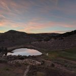 Panoramic view of a lush green golf course at Promontory Pete Dye Golf Course. Smooth