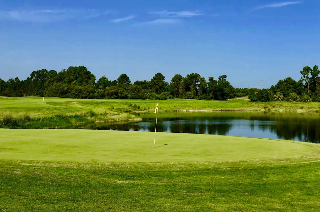 Panoramic view of a lush green golf course at Providence Golf Club. Smooth
