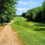 Panoramic view of a lush green golf course at Province Lake Golf Course. Smooth