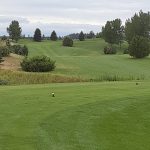 Panoramic view of a lush green golf course at Pryor Creek Golf Club. Smooth