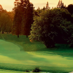 Panoramic view of a lush green golf course at Pumpkin Ridge Golf Club. Smooth