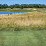 Panoramic view of a lush green golf course at Purgatory Golf Club. Smooth
