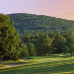 Panoramic view of a lush green golf course at Putnam County Golf Course. Smooth