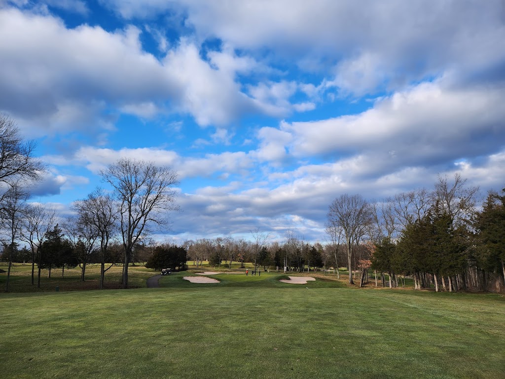 Panoramic view of a lush green golf course at Quail Brook Golf Course. Smooth