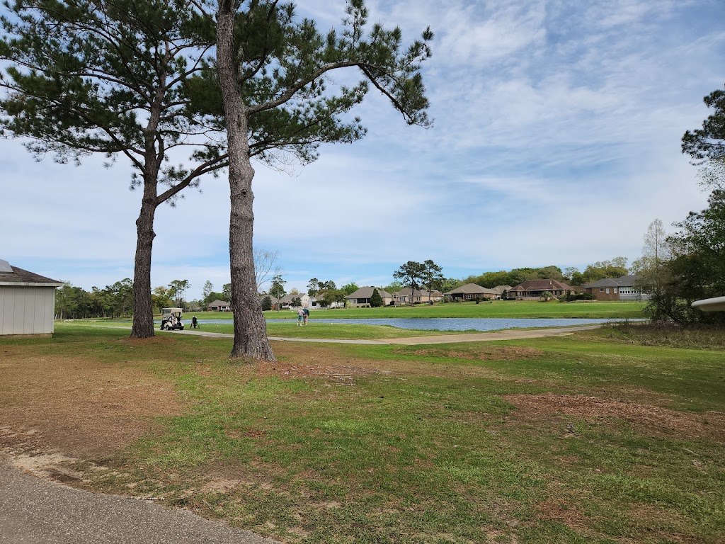 Panoramic view of a lush green golf course at Quail Creek Golf Course. Smooth