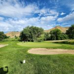 Panoramic view of a lush green golf course at Quail Hollow Golf Course. Smooth