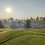 Panoramic view of a lush green golf course at Quail Ridge Golf Course. Smooth