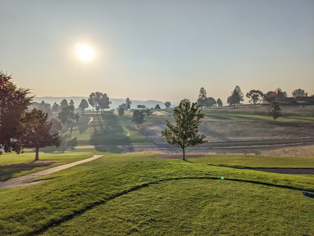 Panoramic view of a lush green golf course at Quail Ridge Golf Course. Smooth