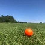 Panoramic view of a lush green golf course at Quail Ridge Golf Course. Smooth
