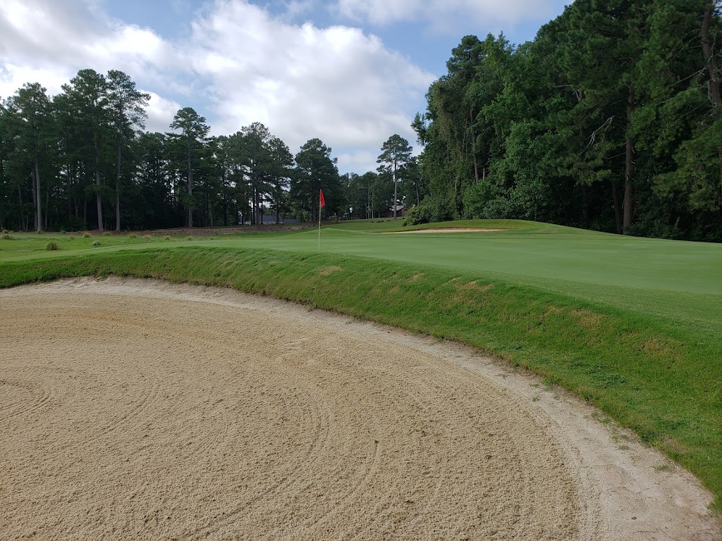 Panoramic view of a lush green golf course at Quail Ridge Golf Course. Smooth