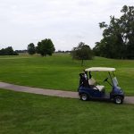 green grass with the flag in the hole.