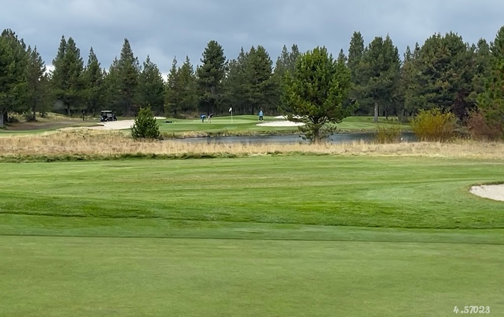 Panoramic view of a lush green golf course at Quail Run Golf Course. Smooth