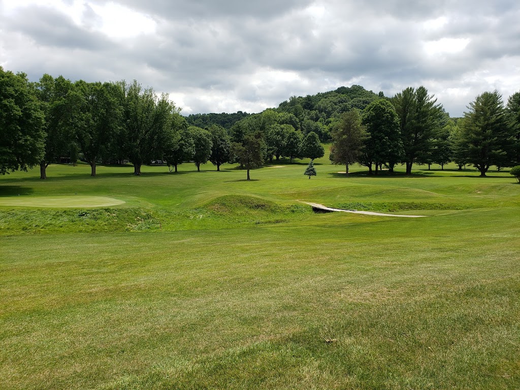Panoramic view of a lush green golf course at Quail Run Golf Links. Smooth