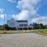 Panoramic view of a lush green golf course at Quaker Hill Country Club. Smooth