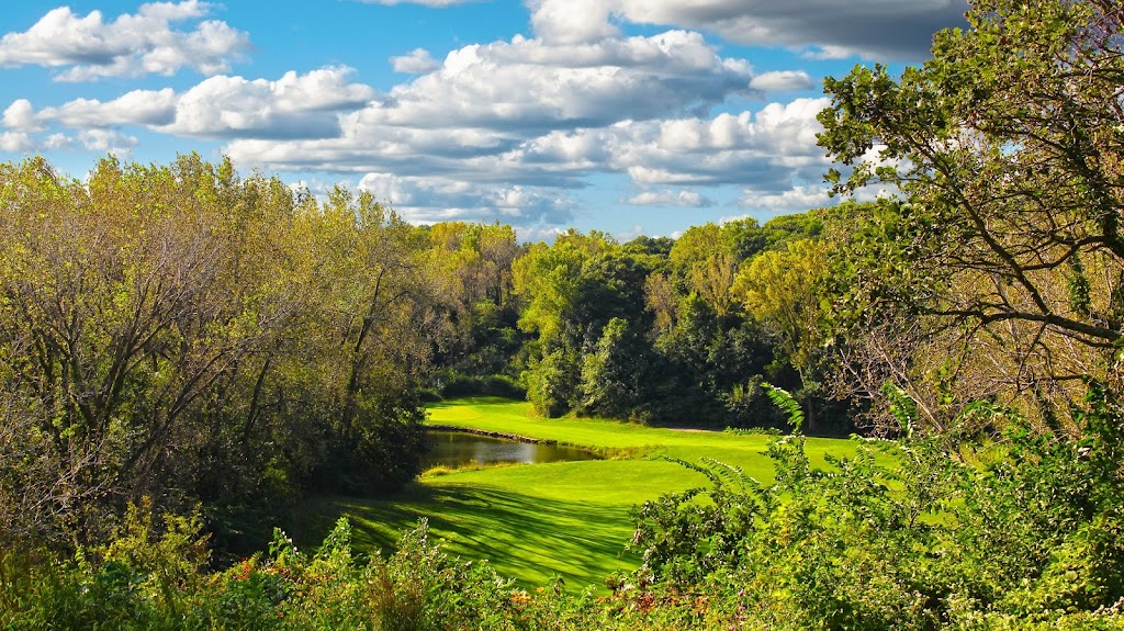 Panoramic view of a lush green golf course at Quarry Oaks Golf Club. Smooth