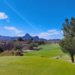 Panoramic view of a lush green golf course at Quarry Pines Golf Club. Smooth