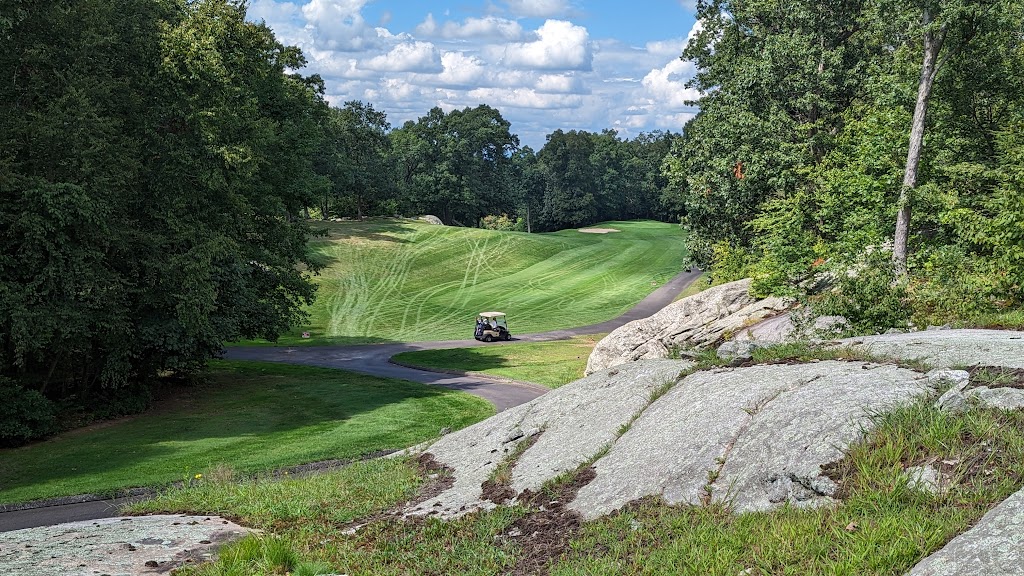 Panoramic view of a lush green golf course at Quarry Ridge Golf Course. Smooth