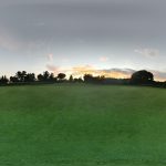green grass with the flag in the hole.