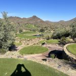 Panoramic view of a lush green golf course at Quintero Golf Club. Smooth