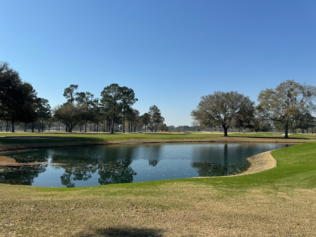 Panoramic view of a lush green golf course at Quixote Club. Smooth