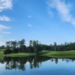 Panoramic view of a lush green golf course at RTJ Golf Trail at Cambrian Ridge. Smooth