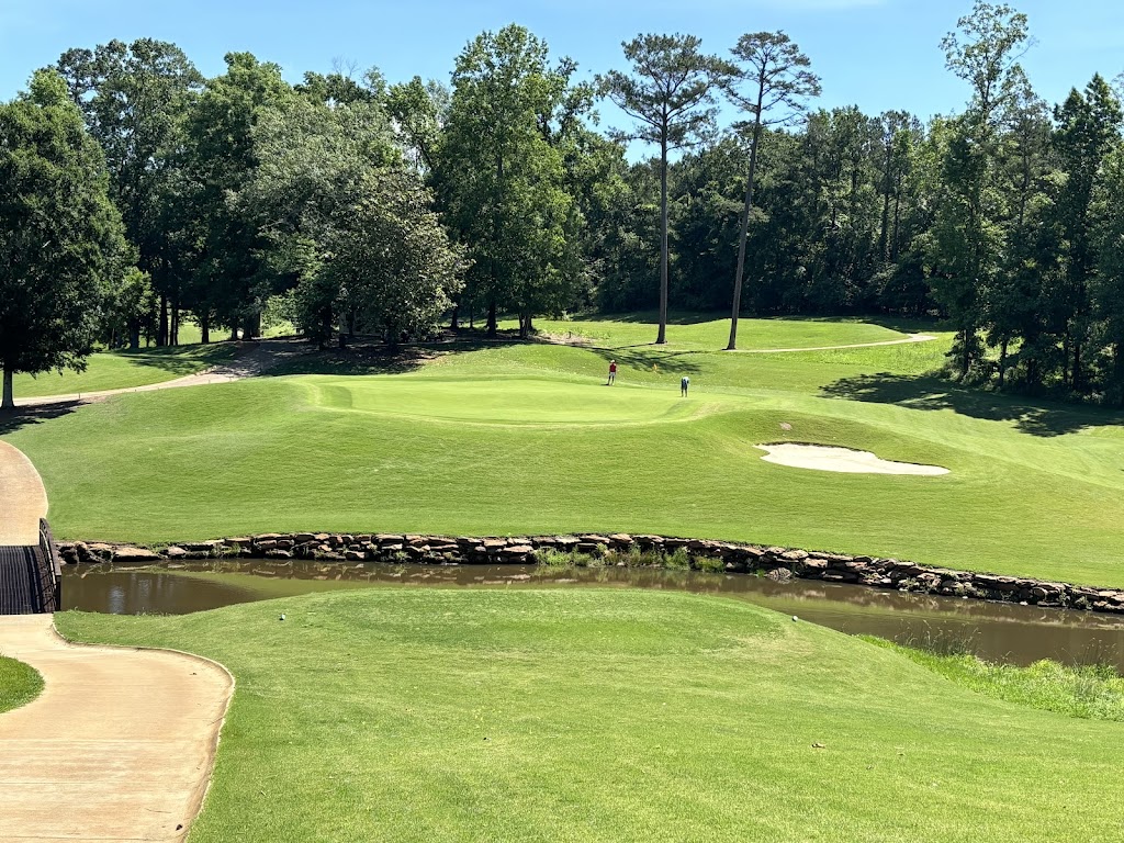 Panoramic view of a lush green golf course at RTJ Golf Trail at Grand National. Smooth