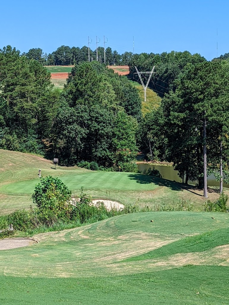 Panoramic view of a lush green golf course at RTJ Golf Trail at Oxmoor Valley. Smooth