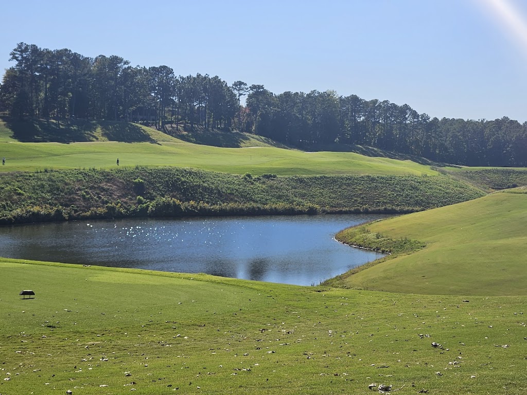 Panoramic view of a lush green golf course at RTJ Golf Trail at Ross Bridge. Smooth