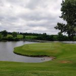 Panoramic view of a lush green golf course at RTJ Golf Trail at Silver Lakes. Smooth