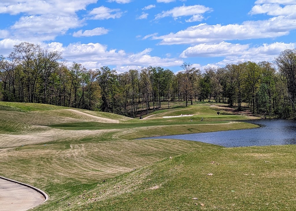 Panoramic view of a lush green golf course at RTJ Golf Trail at The Shoals. Smooth