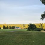 Panoramic view of a lush green golf course at Raceway Golf Club. Smooth