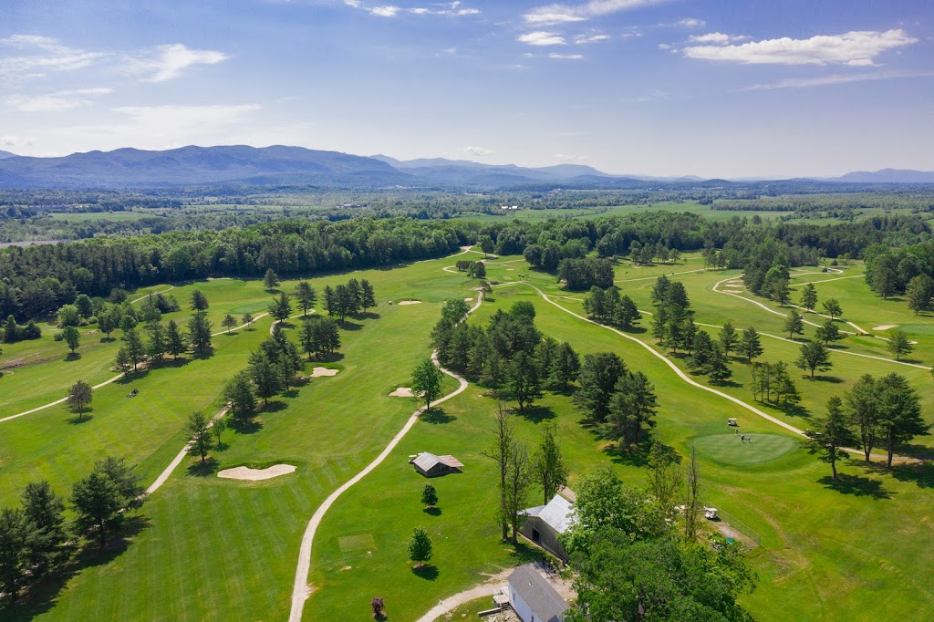 Panoramic view of a lush green golf course at Ralph Myhre Golf Course. Smooth