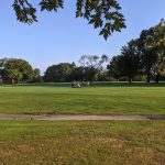 Panoramic view of a lush green golf course at Ramblewood Country Club. Smooth
