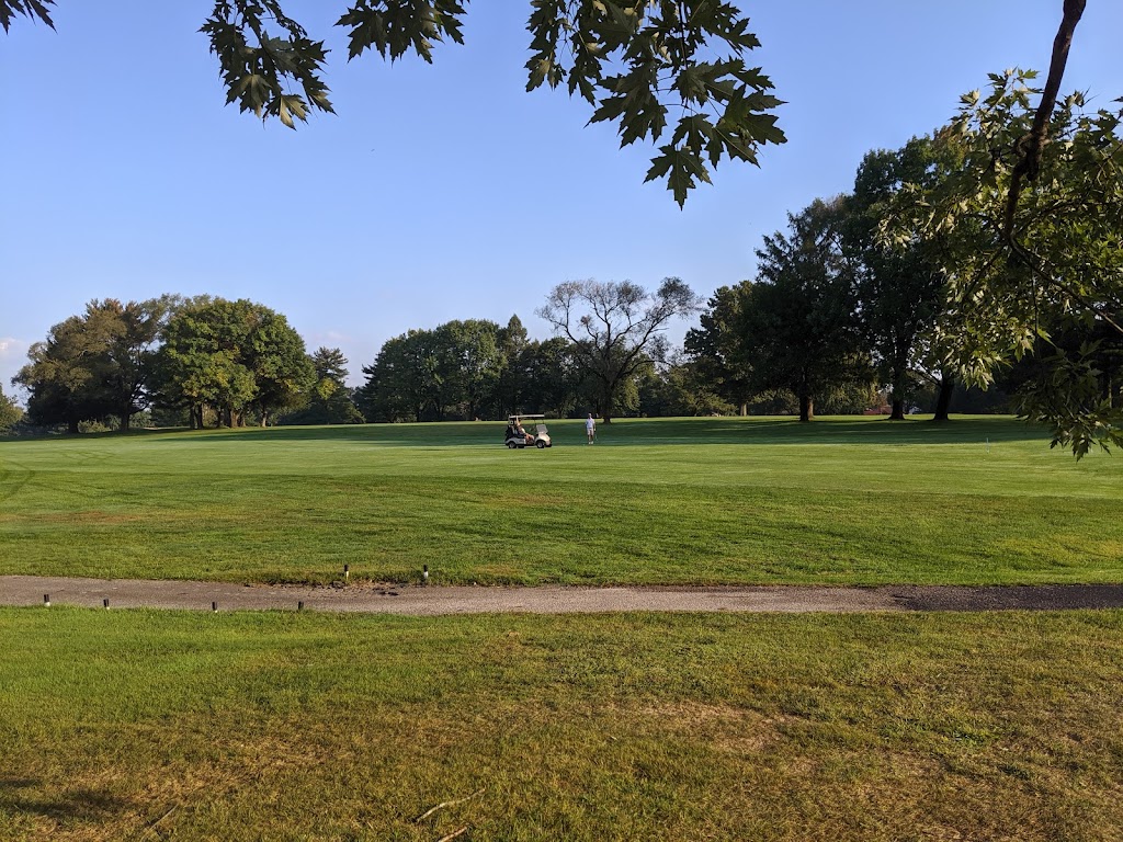 Panoramic view of a lush green golf course at Ramblewood Country Club. Smooth