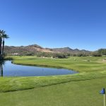 Panoramic view of a lush green golf course at Rancho Manana Golf Club. Smooth