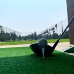 green grass with the flag in the hole.