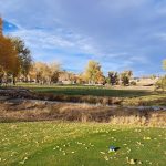Panoramic view of a lush green golf course at Rapid City Executive Golf. Smooth