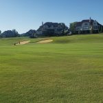 Panoramic view of a lush green golf course at Rarity Bay Golf & Country Club. Smooth