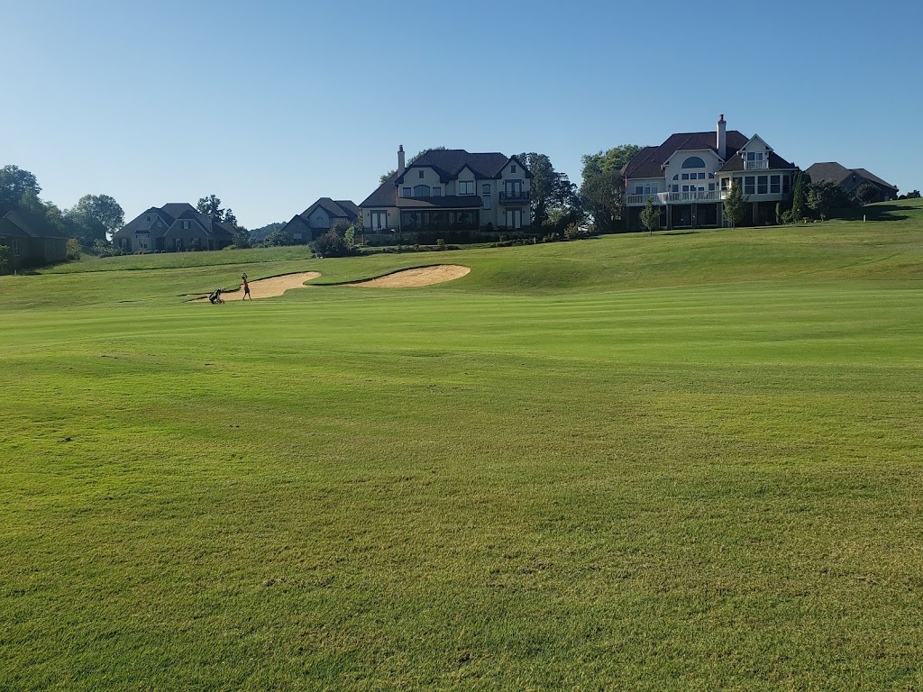 Panoramic view of a lush green golf course at Rarity Bay Golf & Country Club. Smooth