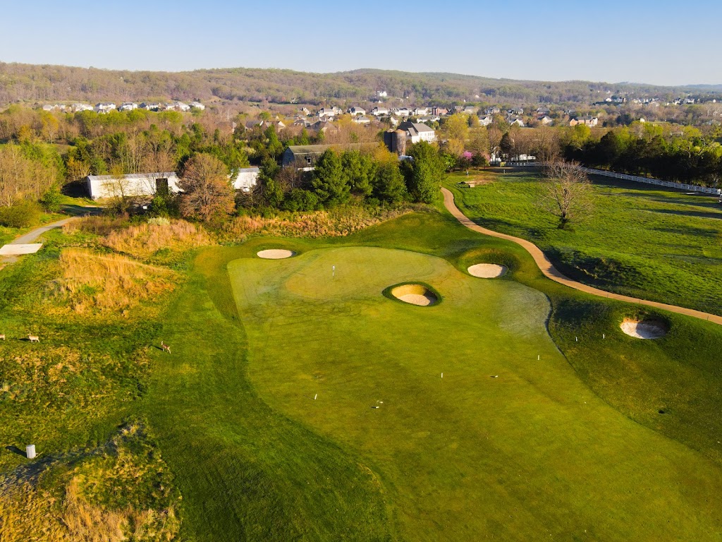 Panoramic view of a lush green golf course at Raspberry Falls Golf & Hunt Club. Smooth