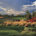 Panoramic view of a lush green golf course at Raven Golf Club. Smooth
