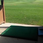 green grass with the flag in the hole.