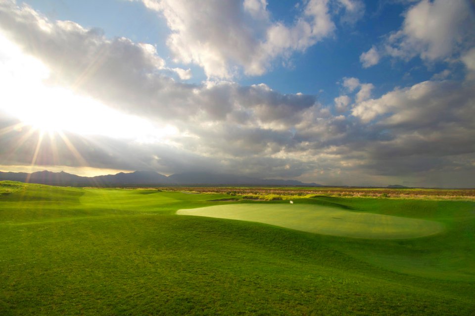 Panoramic view of a lush green golf course at Red Hawk Golf Club. Smooth