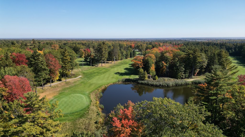 Panoramic view of a lush green golf course at Red Hawk Golf Course. Smooth