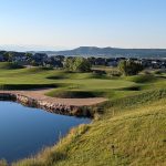 Panoramic view of a lush green golf course at Red Hawk Ridge Golf Course. Smooth