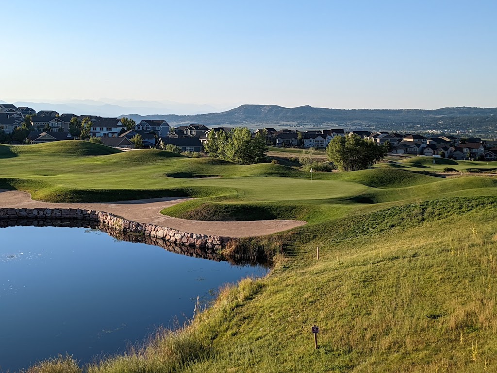 Panoramic view of a lush green golf course at Red Hawk Ridge Golf Course. Smooth