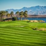 Panoramic view of a lush green golf course at Reflection Bay Golf Club. Smooth